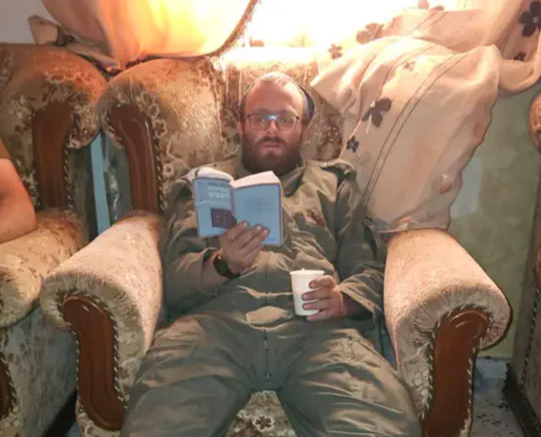 Elisha learning in an armchair, hours before his final mission